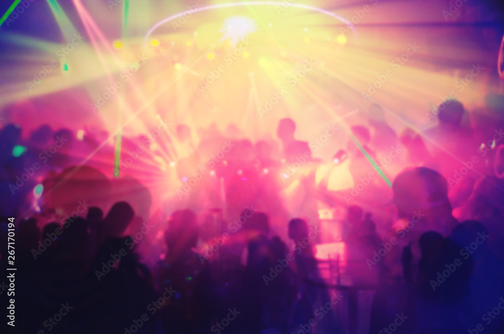 Abstract blur Light And Silhouette hands of audience crowd people enjoying the club party with concert. Blurry night club DJ party people enjoy of music dancing sound.for Background.