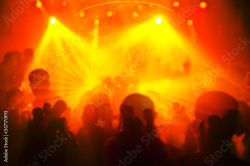 Abstract blur Light And Silhouette hands of audience crowd people enjoying the club party with concert. Blurry night club DJ party people enjoy of music dancing sound.for Background.