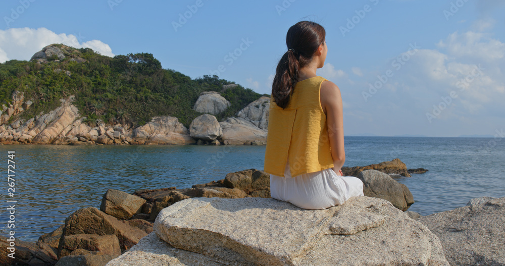 Woman enjoy the view of the sea at summer time