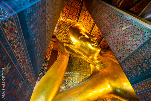 Golden big reclining buddha statue in Wat Pho, Bangkok photo