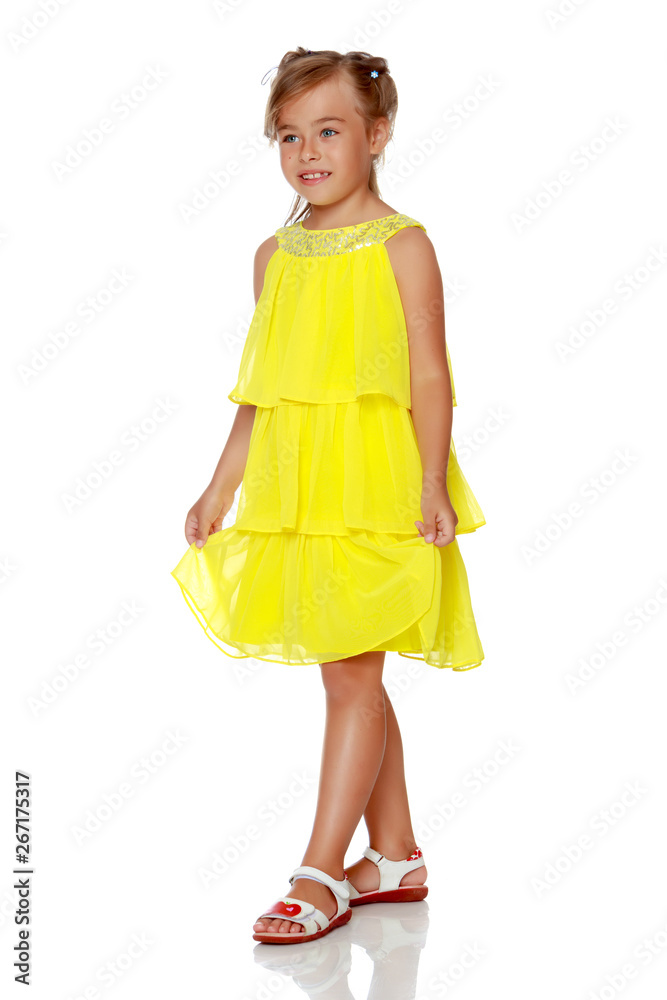 Fashionable little girl in a dress
