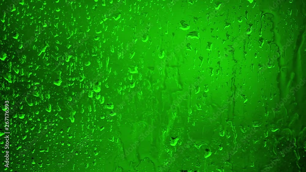 Chroma Key Stock 35 seconds - Close up Water Drops on Glass on a rainy day. 