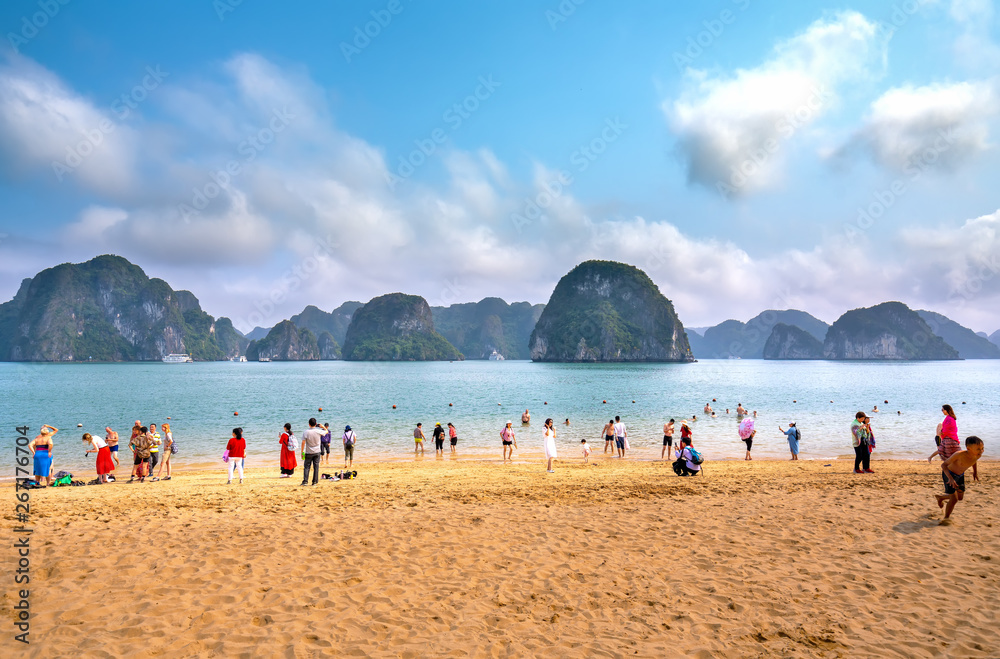Halong bay, Vietnam - April 3rd, 2019: Tourists swimming, exploring around beach in Ti Top Island.It is one of most attractive site for both international and domestic tourists to Halong bay, Vietnam
