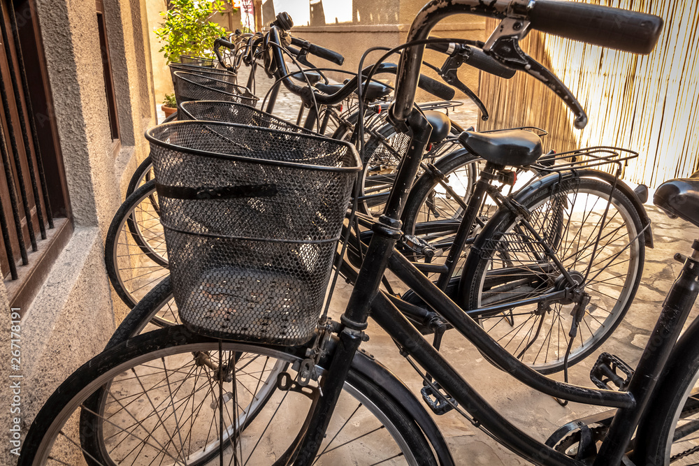 Urban road bike parking with cargo baskets. Urban road bike parking with cargo baskets.