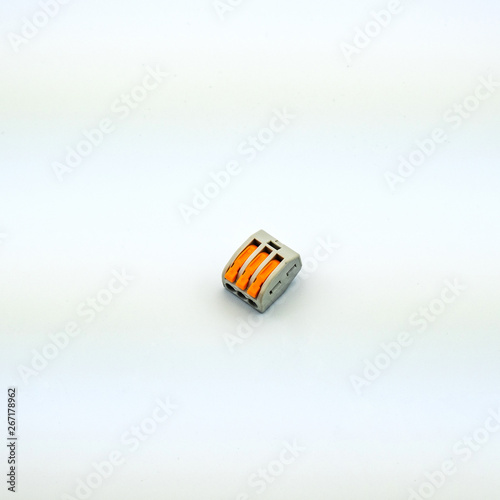 Concept photo of an electrical device in electrical wiring for connecting wires on a white background. Great for the catalog of a modern online store.