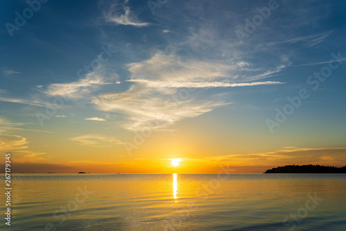 Fototapeta Naklejka Na Ścianę i Meble -  Colorful sunset over calm sea water near tropical beach. Summer vacation concept. Island Phangan, Thailand