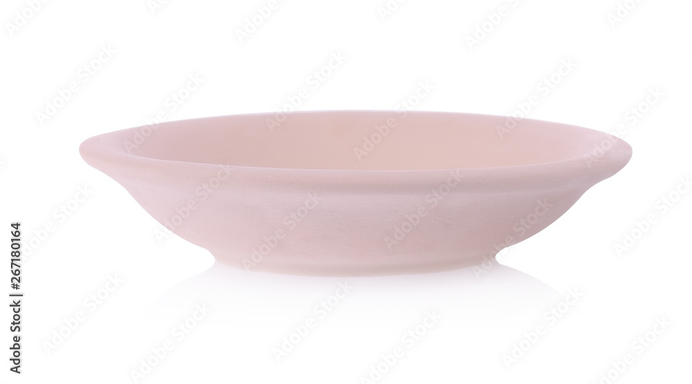 Simple clay plate on white background. Traditional craft. Simple clay plate on white background. Traditional craft.
