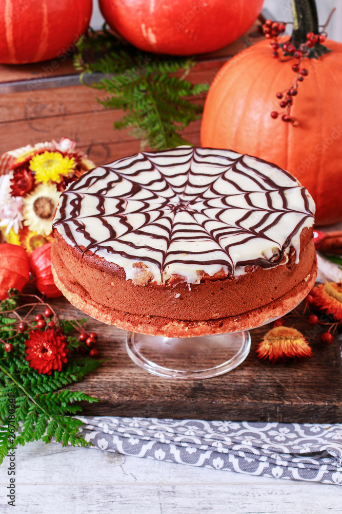 Halloween chocolate spider web cake and pumpkins around. Halloween chocolate spider web cake and pumpkins around.