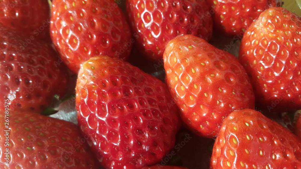 Pile of healthy, fresh organic strawberries in supermarket for sale Pile of healthy, fresh organic strawberries in supermarket for sale