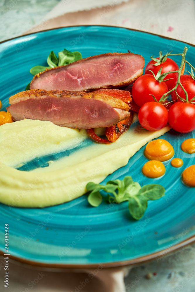 Fried meat with shredded potatoes and tomatoes Fried meat with shredded potatoes and tomatoes