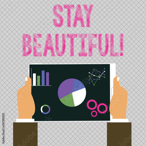 Conceptual hand writing showing Stay Beautiful. Concept meaning living authentically from your heart Being true to yourself Hands Holding Tablet with Search Engine Optimization Screen