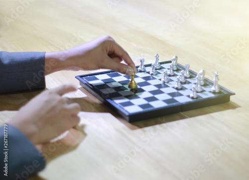 Business man playing chess