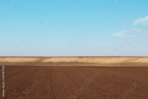 Agriculture Field. Ground In a Distance Shined By The Sun