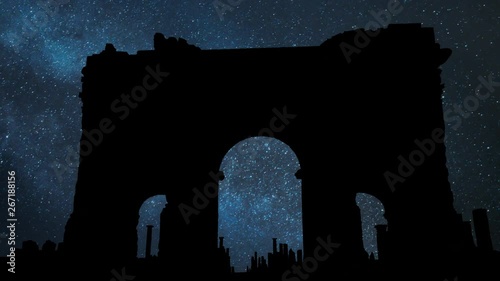 Trajan's Arch in the ruins of Timgad, Night with Stars and Milky Way, Roman-Berber city founded by the Emperor Trajan, Algeria photo