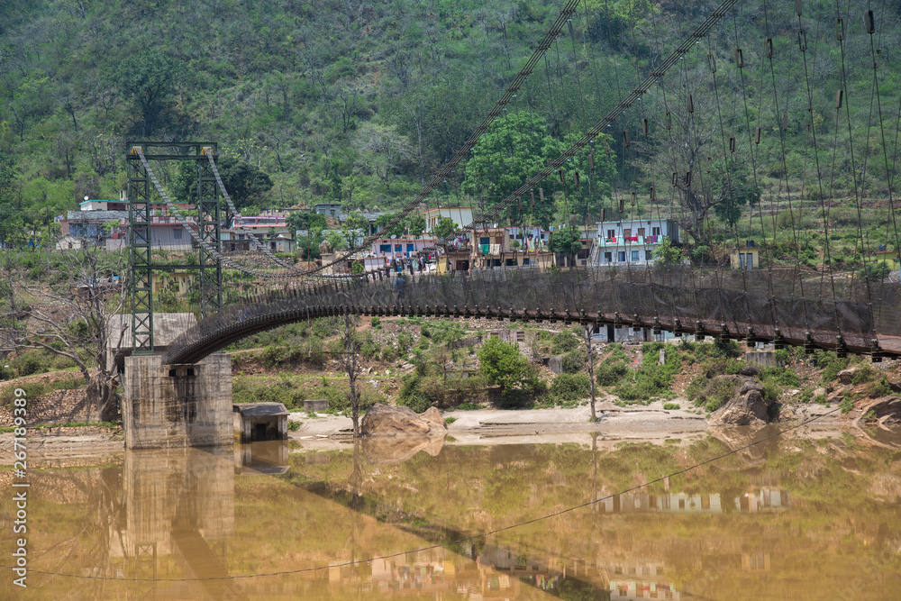 Suspension bridge in the middle of Alaknanda river, India