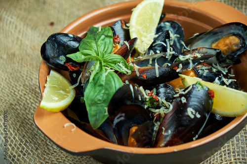 Plate with mussels on a gray background 