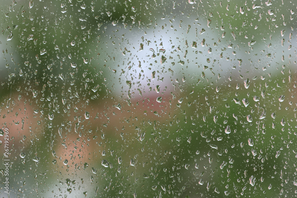 Raindrops on window glass during the rain close up. Natural background Raindrops on window glass during the rain close up. Natural background