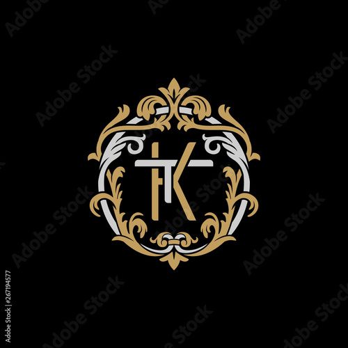 Initial letter T and K, TK, KT, decorative ornament emblem badge, overlapping monogram logo, elegant luxury silver gold color on black background