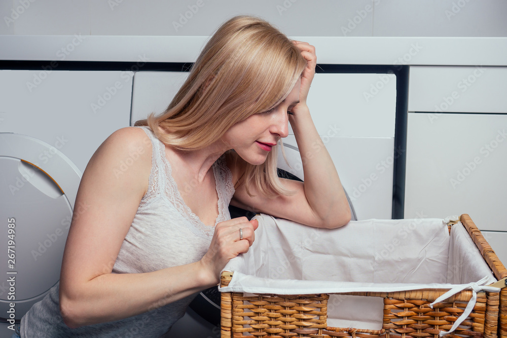 happy blonde female washing clothes feeling happy about soft fresh laundry aroma fabric softener aromatherapy happy blonde female washing clothes feeling happy about soft fresh laundry aroma fabric softener aromatherapy