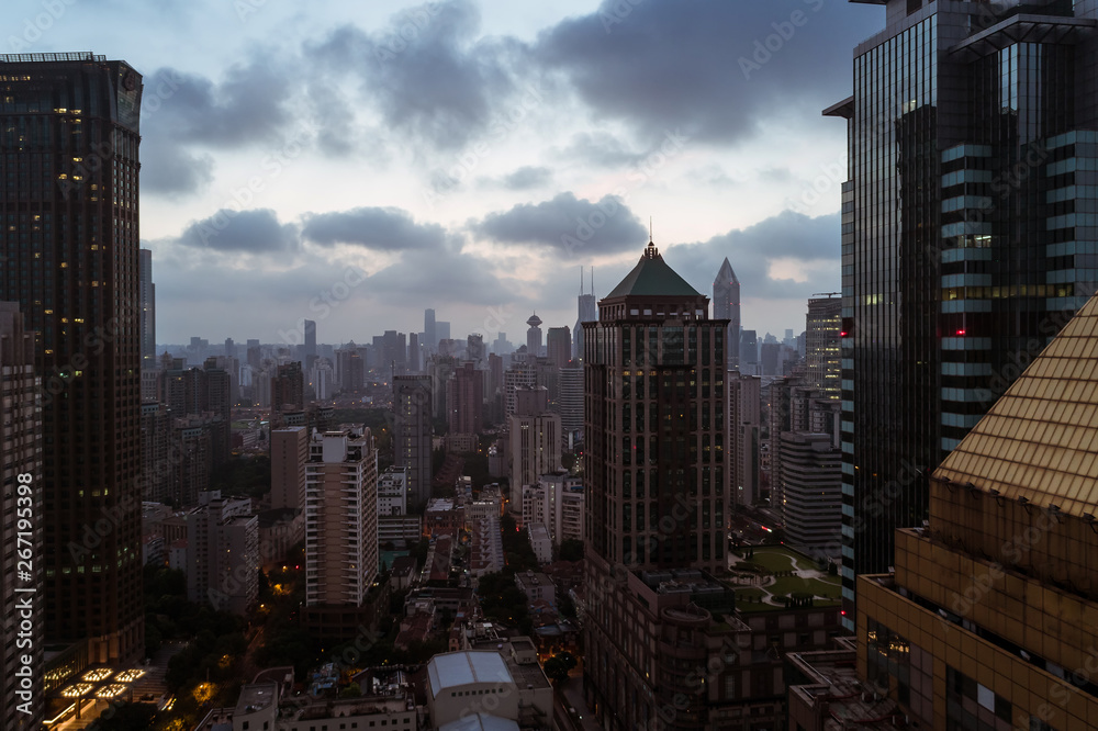 Obraz premium Aerial view of business area and cityscape in the dawn, West Nanjing Road, Jing` an district, Shanghai
