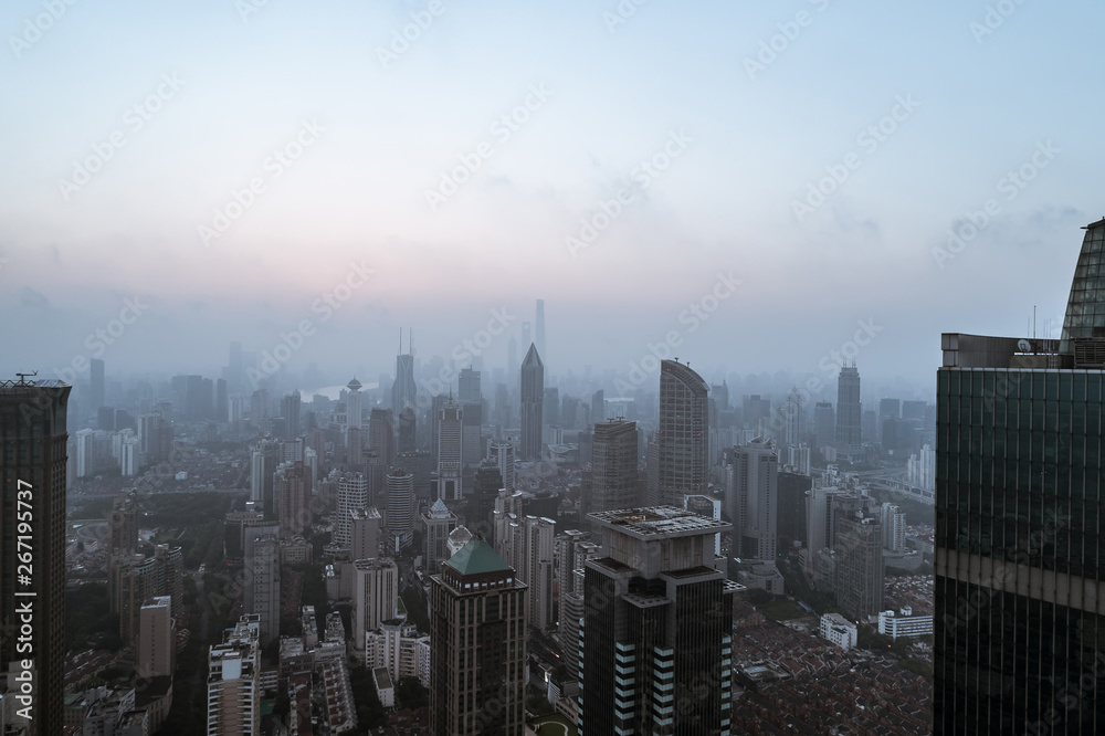Obraz premium Aerial view of business area and cityscape in the dawn, West Nanjing Road, Jing` an district, Shanghai