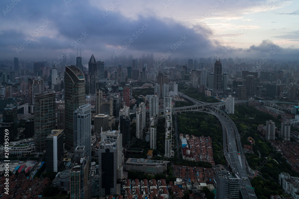 Obraz premium Aerial view of business area and cityscape in the dawn, West Nanjing Road, Jing` an district, Shanghai