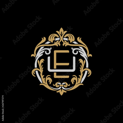 Initial letter U and E, UE, EU, decorative ornament emblem badge, overlapping monogram logo, elegant luxury silver gold color on black background