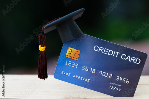 Education payment Credit Card for study Graduate concept: Graduation Cap on Mock up Card, Idea for dept loan playing for successs studying or business have to use so money and alternative risk finance photo