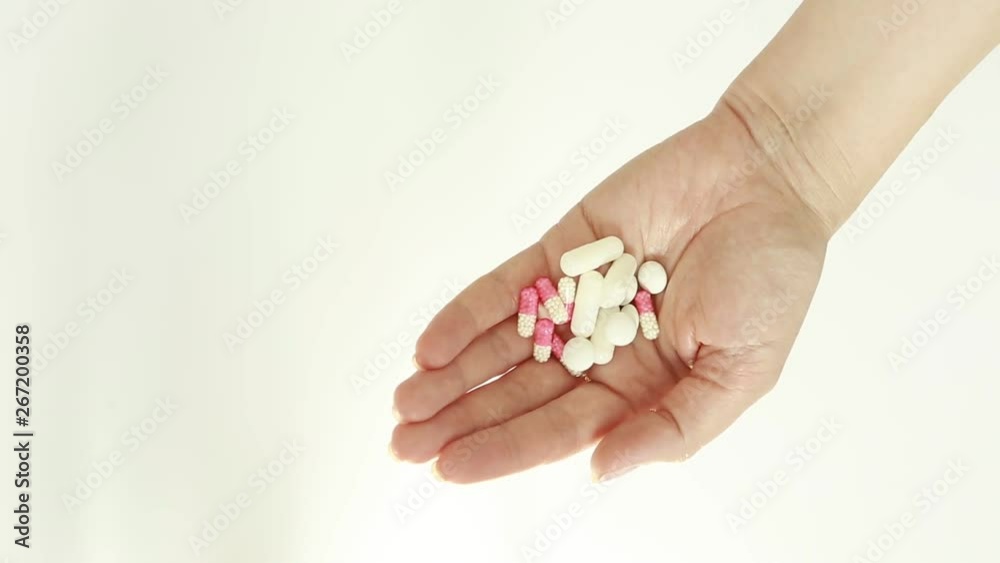 Capsules and pills in hand Capsules and pills in hand