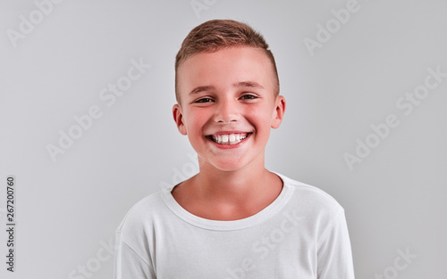 Slika na platnu Cute boy on a gray background