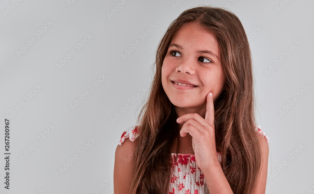 Cute girl on a gray background Cute girl on a gray background