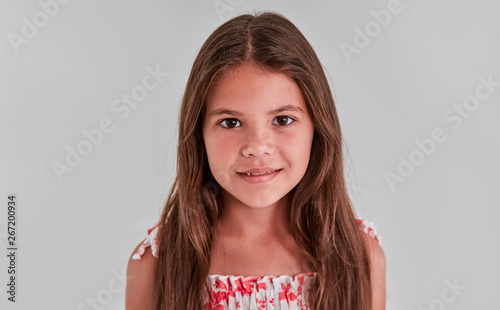 Cute girl on a gray background
