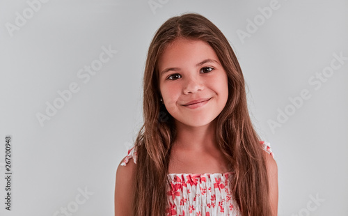Cute girl on a gray background