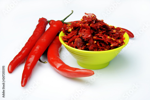 red chili peppers in a bowl isolated on white
