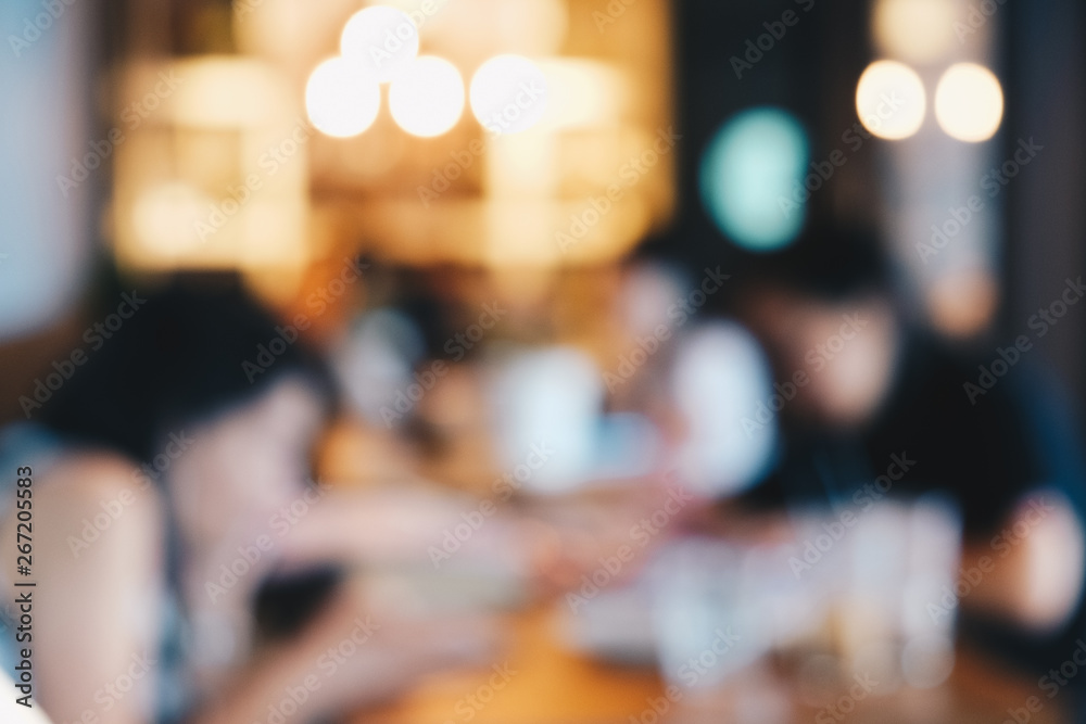 Blurred group of people sitting in cafe restaurant