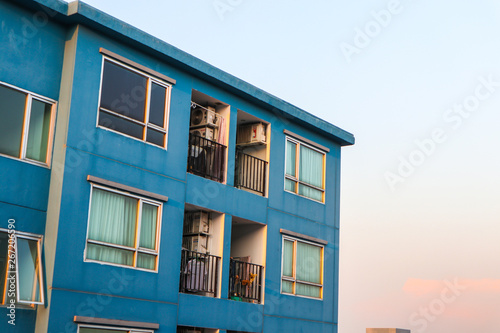 Fototapeta Naklejka Na Ścianę i Meble -  Condominium block city building sunset sky
