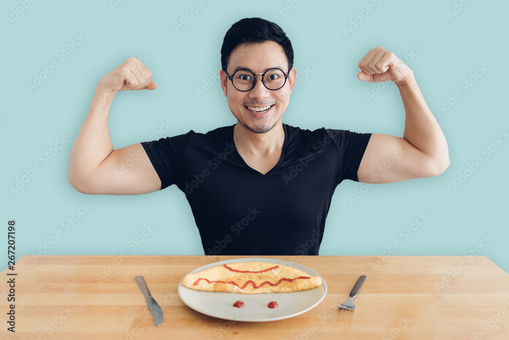 Happy man is eating homemade breakfast set of omelet. Happy man is eating homemade breakfast set of omelet.