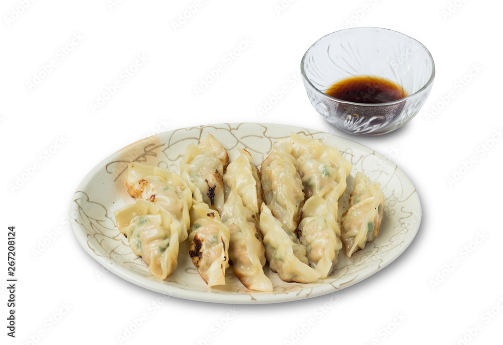 Dumplings or gyoza with soy sauce isolated on white background Dumplings or gyoza with soy sauce isolated on white background
