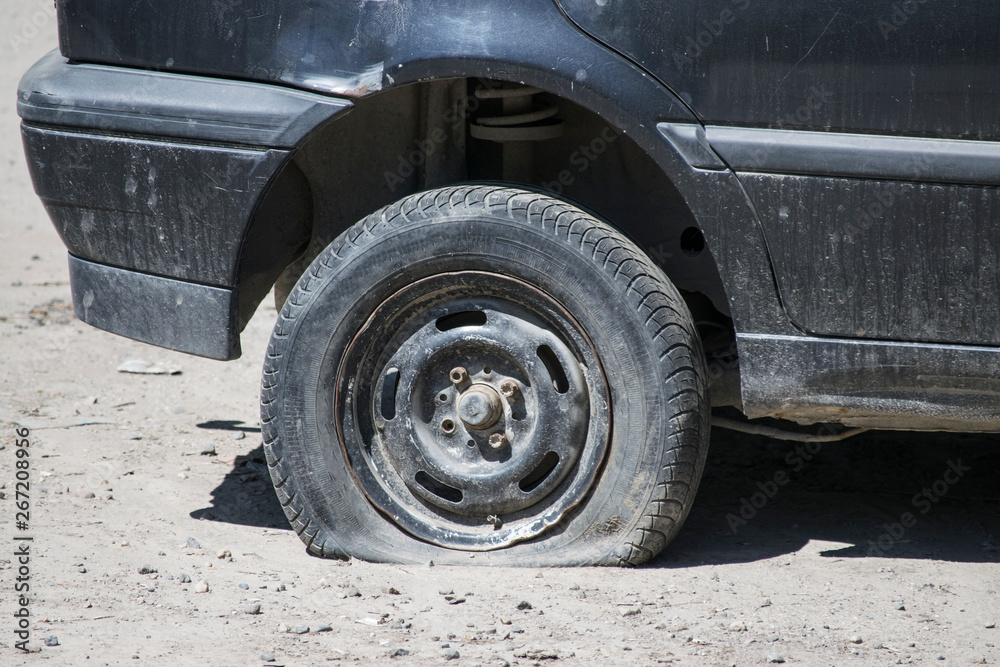 Flat tire while driving on the off-road. Flat tire while driving on the off-road.