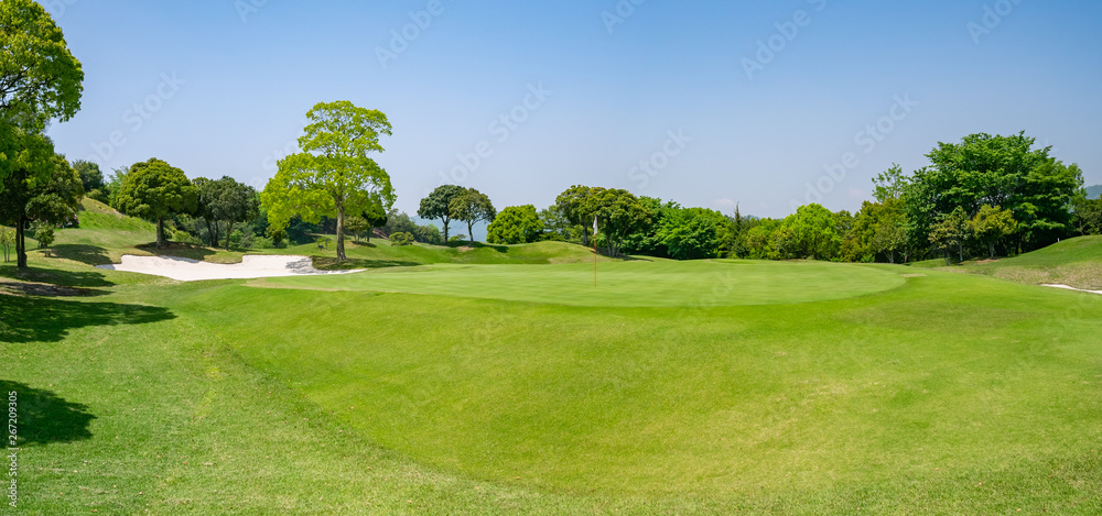 Panorama View of Golf Course with beautiful green. Golf is a sport to play on the turf.