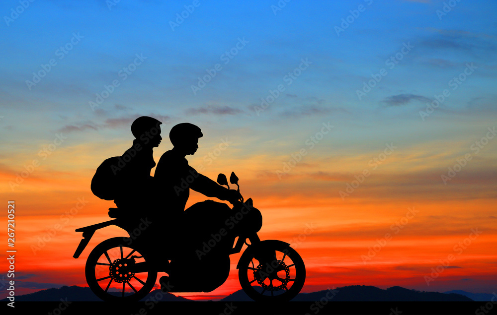 couple on motorcycle sunset