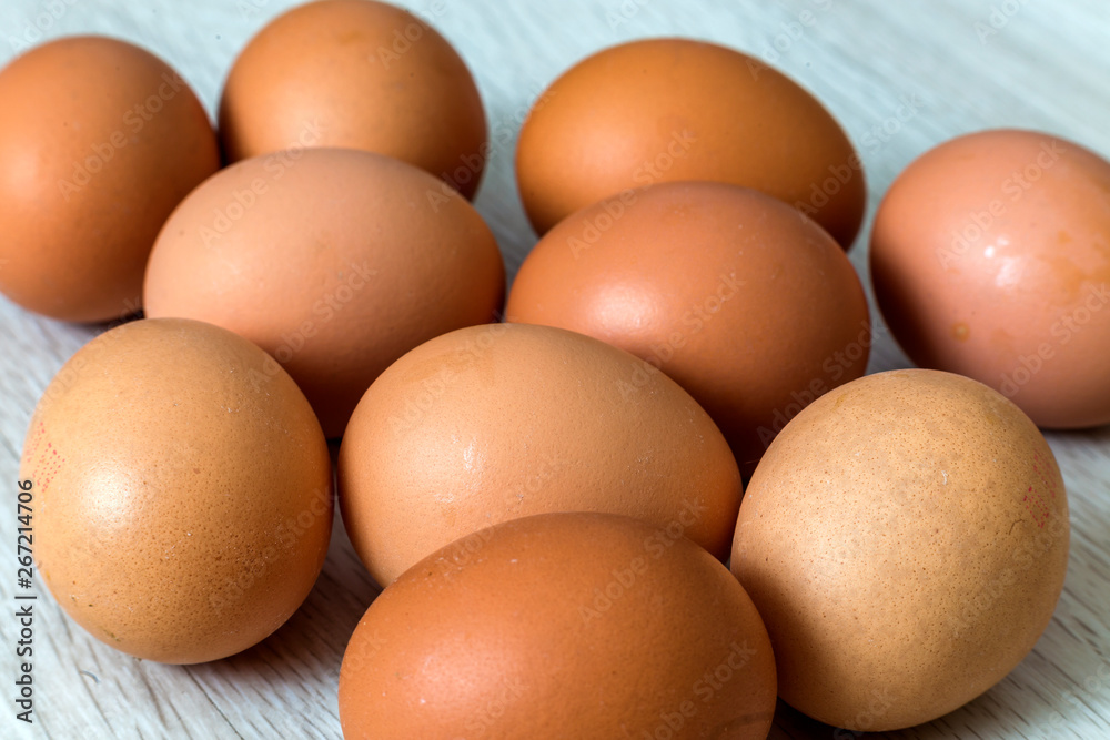 Hen eggs on kitchen table background. Healthy organic food, delicious meal, cholesterol and diet concept. Hen eggs on kitchen table background. Healthy organic food, delicious meal, cholesterol and diet concept.