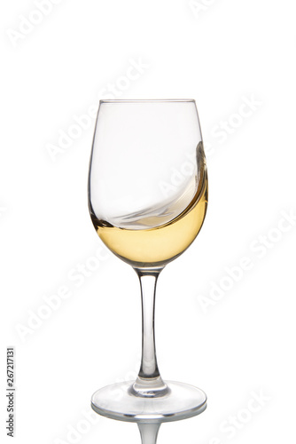 Glass of white wine isolated on a white background.