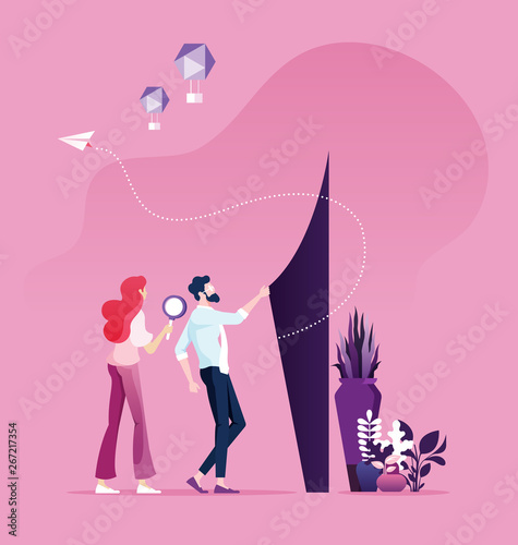 Businessman and woman trying to find way out