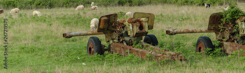 Anti-aircraft warfare (counter-air defense) abandoned. Wrecks of old vehicles belonging to the Albanian army in the air field photo
