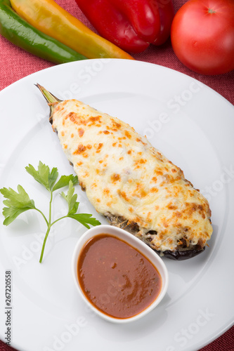 Baked eggplant stuffed with cheese and mushrooms