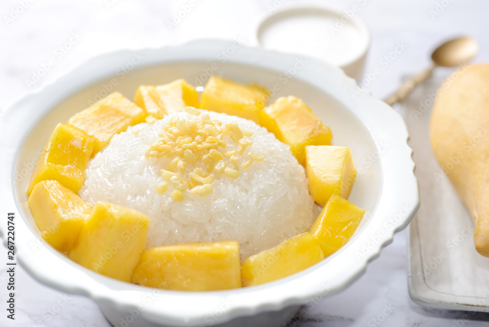Mango sticky rice is a traditional Thai dessert made with glutinous rice, fresh mango and coconut milk, and eaten with a fork, spoon, or sometimes the hands. Mango sticky rice is a traditional Thai dessert made with glutinous rice, fresh mango and coconut milk, and eaten with a fork, spoon, or sometimes the hands.