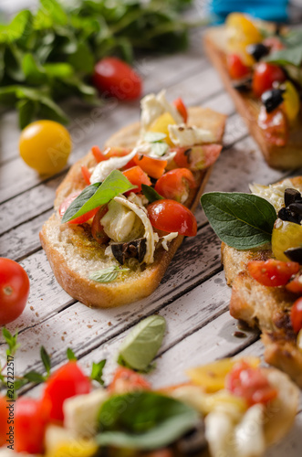 Crostini with tomatoes and olives