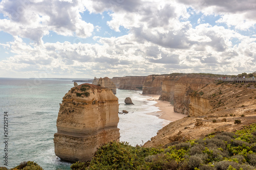 Scenic view alongside the Great Ocean Road in Australia including the Twelve Apostles limestone stack formations.