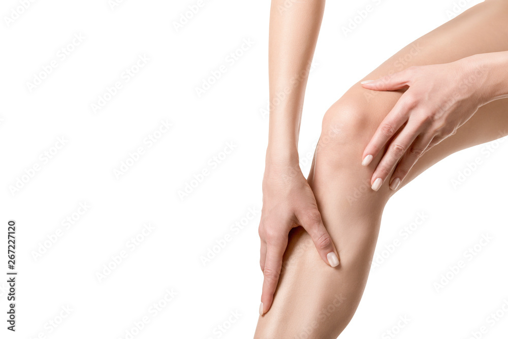 Human injured knee joint. Person touches a sore spot on leg by hands. Well groomed skin, close up, isolated on white Human injured knee joint. Person touches a sore spot on leg by hands. Well groomed skin, close up, isolated on white